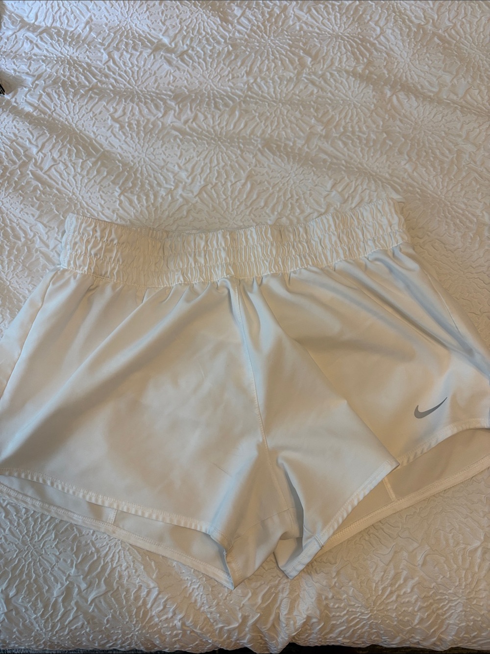 Nike Women's White Athletic Shorts with Silver Swoosh